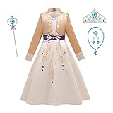 Vestido crema con detalles dorados y morados, fajín morado en la cintura, dobladillo alto-bajo, escote festoneado y chaqueta de punto con detalles a juego.