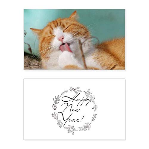 Tarjeta de año nuevo con mensaje de bendición y un tierno diseño de gato