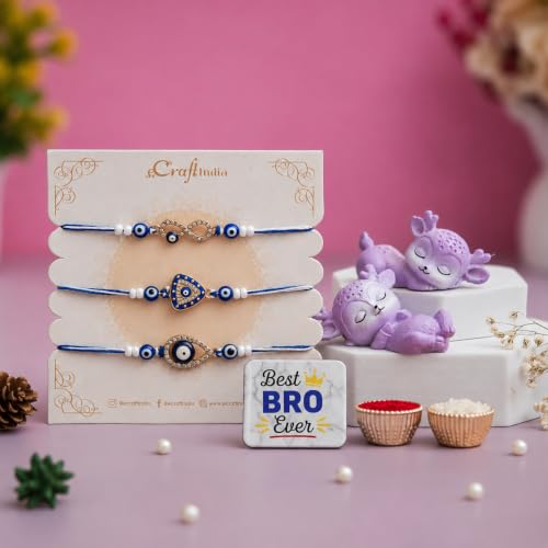 Image of eCraftIndia Set of 3 Evil Eye Rakhi for Brother with Best Bro Ever Fridge Magnet & Sleeping Deer Showpiece | Premium Blue Raksha Bandhan Gift Set with Roli Chawal