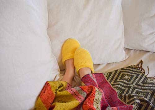 slide on Aromatherapy women's slippers featuring heatable lavender-filled aromatherapy insoles. Spa-style slide-on slippers with a fuzzy faux fur exterior.3