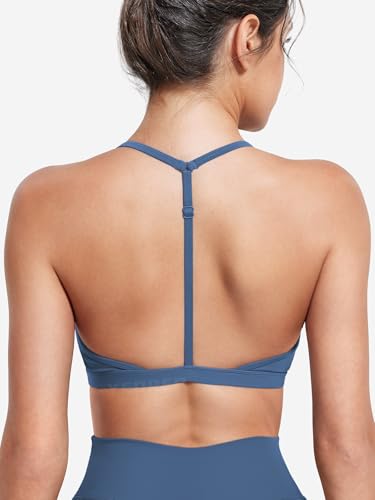 Image of YEOREO CoreFlex Sports Bras for Women Strappy Padded Halter Open Back Light Impact Deep V Neck Yoga Workout Gym Tops