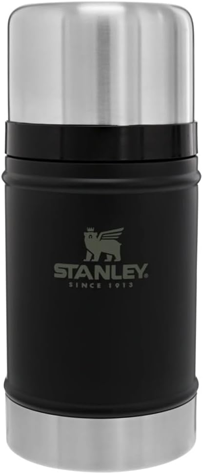 A rugged, green Stanley Classic Legendary Food Jar with its lid off.