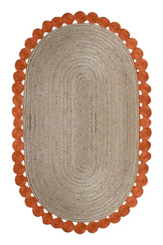 Tapis ovale en jute orange pour l'ambiance chaleureuse d'une maison de lac