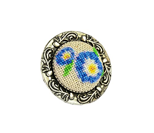 Handmade embroidered brooch with blue flower