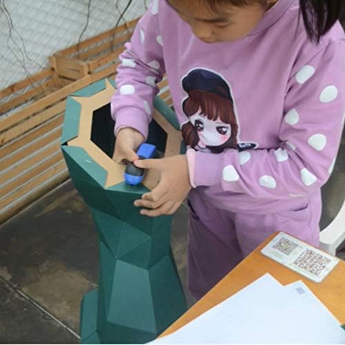 Child using a stapler on papercraft