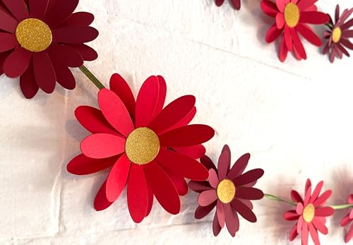 Image of Red Daisy Flower Wall and Party Decor. This Easy Decor kit Comes with 18 Paper Flowers, Needle, 10 feet Satin Ribbon and Sticky Foam Squares.