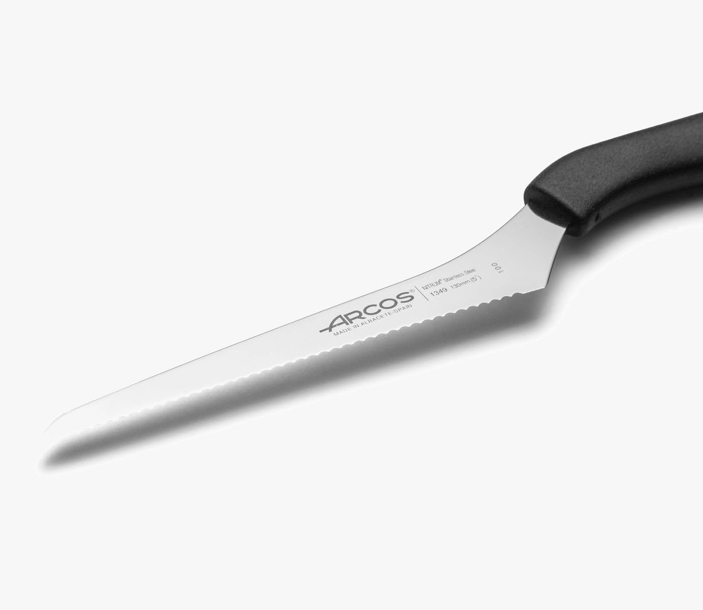 Curved utility knife Arcos Nice Series 134900. Nitrum stainless steel knife with 13 cm (5.12") blade in blister.