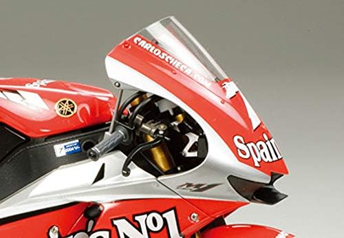 Close-up of the cockpit and windscreen area of the Tamiya 1/12 Yamaha YZR-M1 2004 model, highlighting the instrument panel and handlebar details.