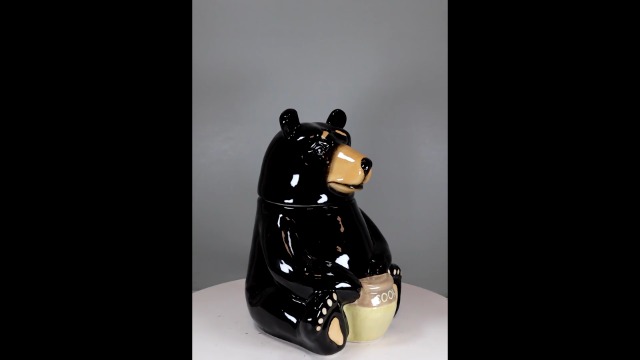 Premium AI Image | A Bear In The Process Of Harvesting Honey From A Beehive