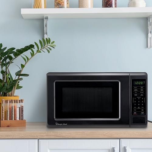 Image of Magic Chef 0.7 cu. ft. Countertop Microwave in Black - 700W (10.1 inchH x 17 inchW x 12.5 inchD) MC77MB