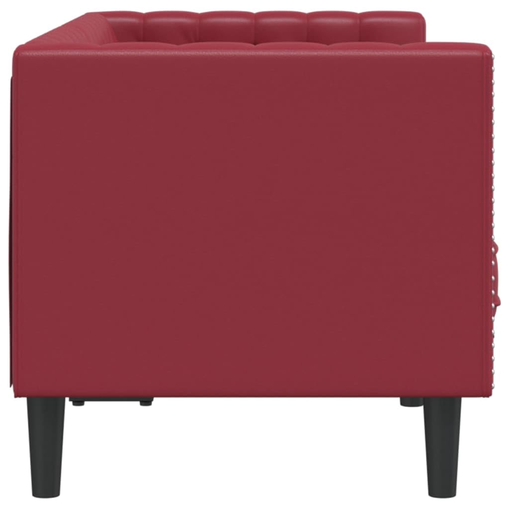 Comoda poltrona Chesterfield in similpelle vinaccia, con classica cucitura a bottoni e forma imbottita per una comoda seduta a 2 posti