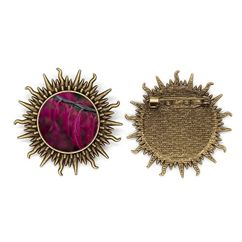 Broche métallique design nature rouge et soleil pour sublimer vos vestes