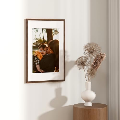 Image of FLYJOE 16x24 Oak Wood Picture Frame with Mat for 12x18, 16 by 24 USA-Sourced Natural Solid Wooden Poster Frame for Wall Display, Tempered Real Glass, Hanging Hardware Included, 1 Pack, Walnut Color