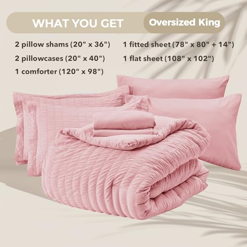 Image of HYMOKEGE Pink Oversized King Comforter Set Seersucker 7 Pieces, All Season Luxury Bed in a Bag for Bedroom, Bedding Set with Comforter, Sheets, Pillowcases & Shams