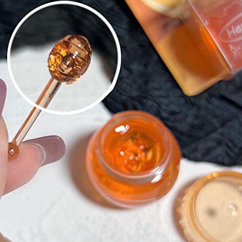 Balsamo labbra al miele con cucchiaio di miele |