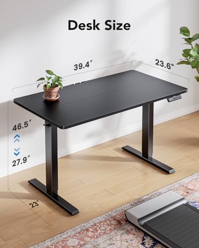HUANUO 40" x 24" Electric Standing Desk Adjustable Height, 4 Memory Height Settings, Headphone Hook, Cable Manager, Sit Stand Up Desk for Home Office & Computer Workstation, Black