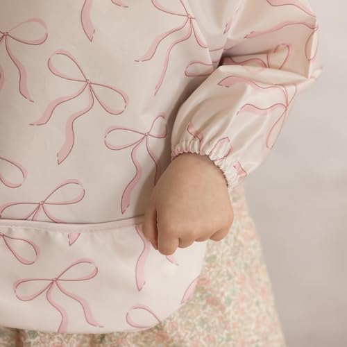 Image of Tiny Twinkle Long Sleeve Bib for Babies & Toddlers | Waterproof Smock Bib for Eating | Machine Washable & Mess-Proof Feeding Essentials | Newborn Shower Gift (Bows, Small 6-24 Months)