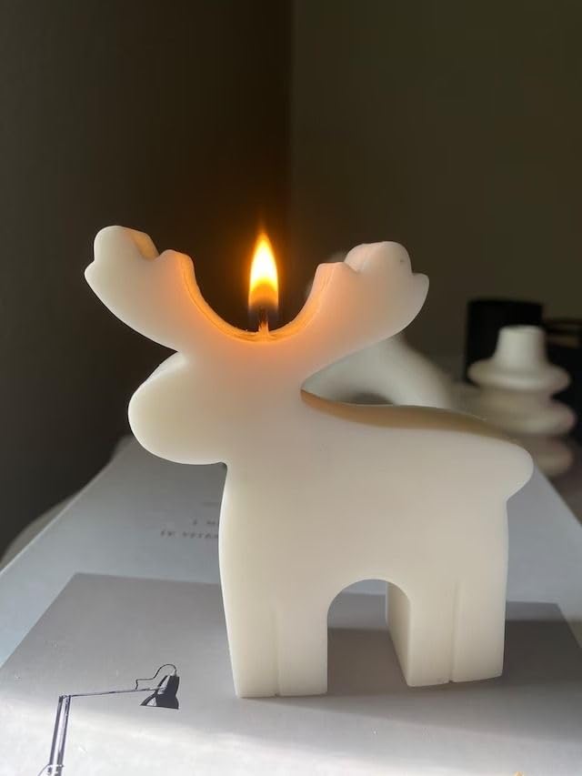 Image of Reindeer Shaped Christmas Candle, White Wax, Festive Holiday Decoration, Red Ribbon Bell Accent
