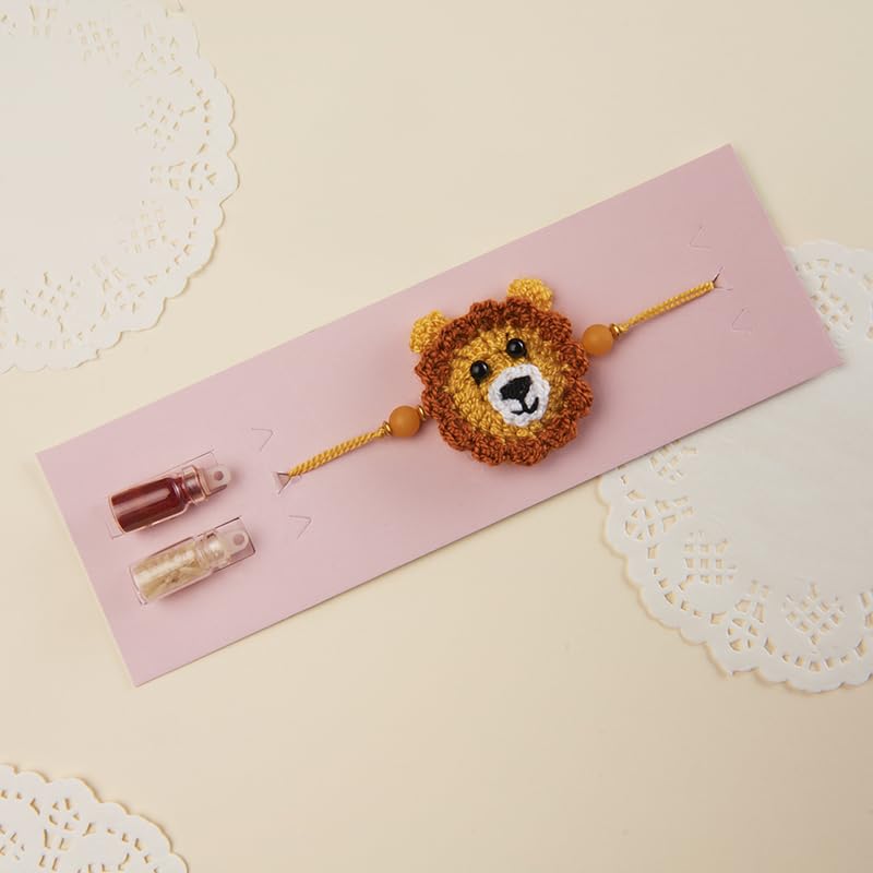 Image of THE GIFT STUDIO.COM | Crochet Lion Rakhi for Kids | Handmade Animal Theme Rakhi for Kids | Raksha Bandhan Special