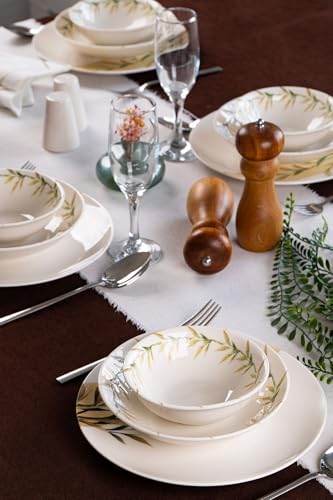 Elegante vajilla de 18 piezas, 100% porcelana. Consta de 6 platos de servir (25 cm), 6 platos hondos (19 cm) y 6 cuencos (14 cm). Perfecto para comidas con estilo