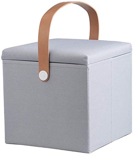 Repose-pieds de rangement vivant gris pour un salon ordonné et cosy