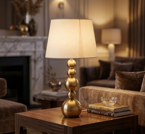 Image of Gold Metal Ball Table Lamp with Neutral Linen Shade - 5-Tier Spherical Base Design - Premium Brass Finish Accent Light for Modern Home Interiors & Bedside Tables