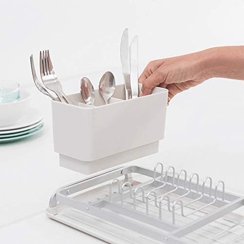 Hand removing the cutlery holder from the Brabantia Compact Dish Drying Rack.