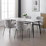 DESIGN MINIMALISTE MODERNE: Cette chaise de salle à manger présente un style contemporain avec un dossier ouvert qui épouse les courbes naturelles du corps. Les accoudoirs sont placés à une hauteur confortable pour un soutien détendu, complétés par des pieds en métal noir élégants pour créer un look global d'une simplicité élégante.