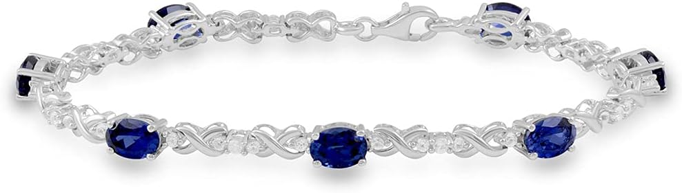 Jewelili Sterling Silver 7x5 MM Oval Shape Created Blue Sapphire and Round Created White Sapphire Link Bracelet, 7.25"