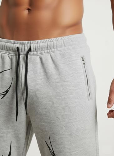 Image of Aesthetic Gothic Wide Leg Pants for Men | Tribal Print Baggy Streetwear | Oversized Track Pants with Elastic Waist | Black and White Relaxed Fit Bottoms