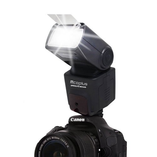 Mcoplus MCO-430 Speedlite mounted on a Canon DSLR camera, with the flash head tilted upwards and diffuser panel extended.