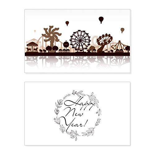 Tarjeta de Año Nuevo con silueta negra de parque de atracciones para felicitar las fiestas