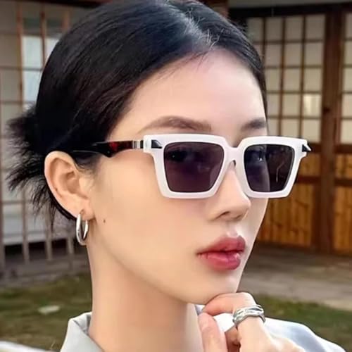 Lunettes de soleil de luxe aux finitions rivets et design rétro pour une allure remarquable