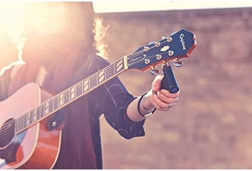 User tuning an acoustic guitar with Roadie 2