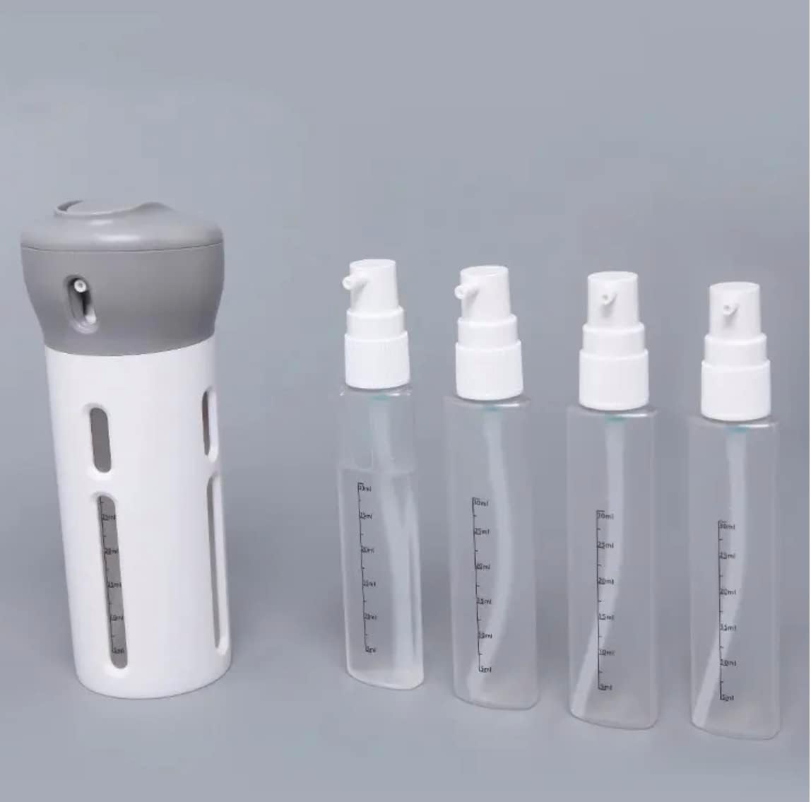 Four In One Travel Bottle with Pump Dispenser (Light Pink) | Labels Included | Reusable | Refillable | Container | Bottle | Travel | Four-In-One | TSA Friendly | Space Saving |