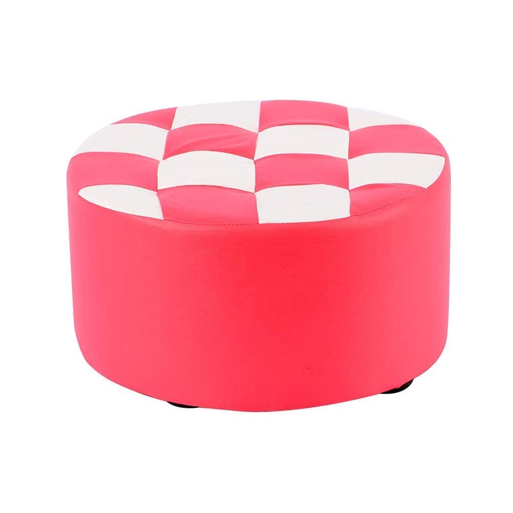 Table basse ronde repose-pieds blanc rose pour créer un coin lecture cosy et chaleureux
