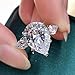 Hsitgexf Shining Classic Plated Silver Pear Cut Teardrop Halo Cubic Zirconia CZ Statement 3-Stone Eternity Wedding Engagement Ring for Women (US size 7)