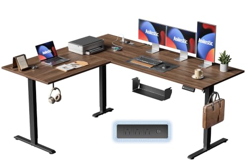 Image of 63 Inch L Shaped Electric Standing Desk, Corner Workstation, Dark Walnut | 3 AC outlets, 2 USB ports, cable tray, cord clips, 3 memory presets, anti-collision and 176 lb capacity for home office.