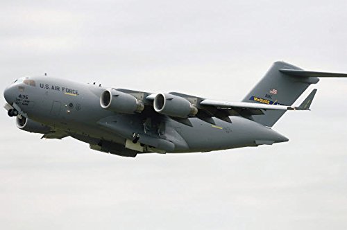 A C-17 Globemaster III in flight Poster Print by Stocktrek Images (17 x 11)