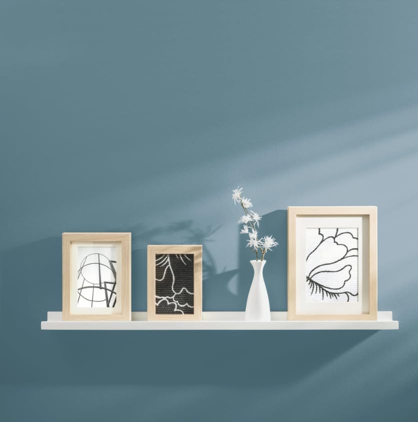 Close-up of the Dolle Border Shelf showing its U-shaped design and smooth white finish.