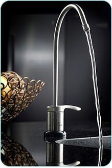 Chrome faucet dispensing filtered water