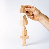 Topple Rocks includes 6 hand made wooden rocks in a draw string bag. The set will have 2 large, 2 medium, and 2 small wooden rocks.