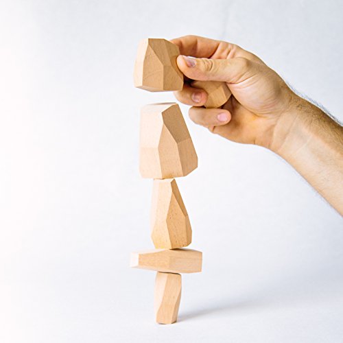 Topple Rocks includes 6 hand made wooden rocks in a draw string bag. The set will have 2 large, 2 medium, and 2 small wooden rocks.