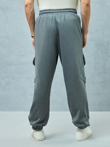Image of Bewakoof Men's Fleece Super Loose Fit Joggers|Bewakoof Heavy Duty 1.0 | Track pants for man | Lower for man | Trouser for men | Baggy trackpants for men | Multipurpose | Mens Lower Activewear | Utility Pockets | Lightweight & Flexible Elastic Waist | Casual Joggers | Loose Fit