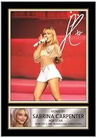 Iconic Live Performance Artwork – Features Sabrina Carpenter captured mid-performance with microphone in hand, showcasing her signature stage presence and pop energy. Printed Autograph Style Design – Includes a printed signature incorporated into the...
