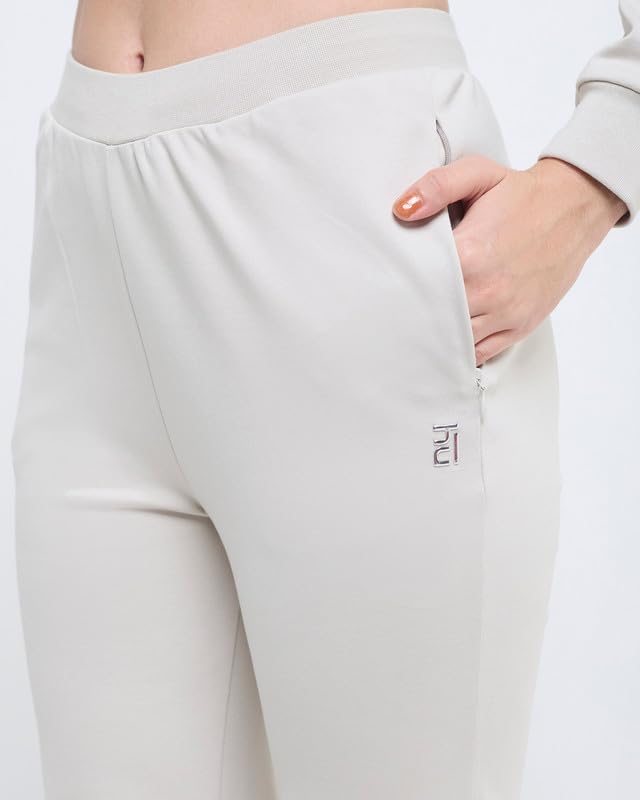 Image of HUNNIT Essential Flare Pants for Women with Zip Pockets | Mid Waist Solid Cotton Tapered Flare Pants | Bootcut Flared Trousers with Wide Elastic Waistband | Relaxed Fit Flared Trouser