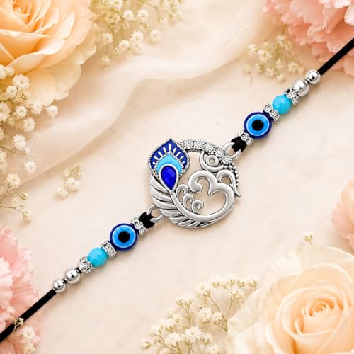Image of Riddhika Ventures Religious Meenakari Om and Peacock Feather Rakhi With Roli Chawal And Greeting Card