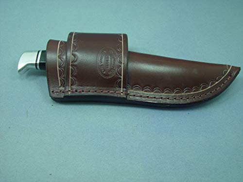 Custom Cross Draw Knife Sheath for the Buck 105 KnifeThe BK 17 and the Sog seal pup knives.. The Sheath Is Made Out of 10 Ounce Water Buffalo Leather with Border Tooling. The Sheath Is Dyed Dark Brown. The Sheath Can Be Worn on the Right or Left Hand Side.