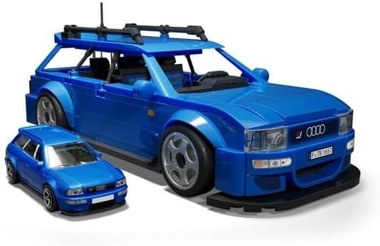 Assembled MEGA Hot Wheels Audi Avant RS2 model next to a smaller die-cast version.