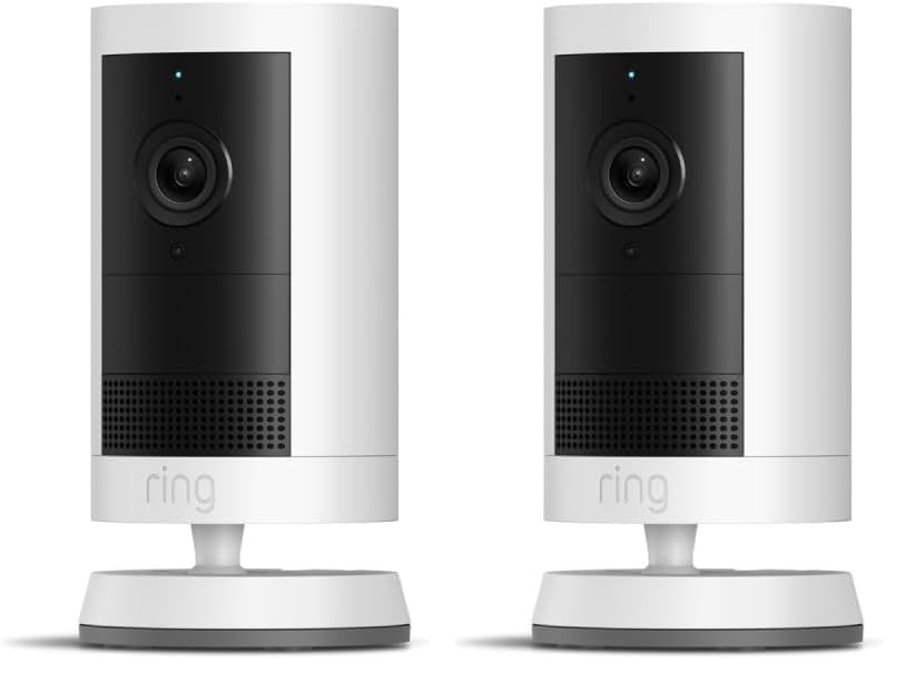 Two white Ring Outdoor Cam Plus cameras standing upright on their bases.